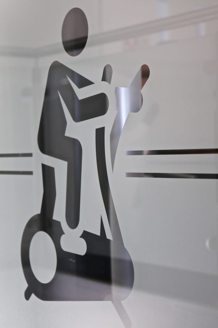 Osprey Hotel Gym Glass cut out of man on Cross trainer