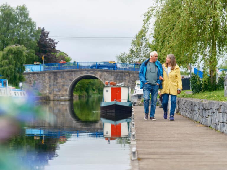 Couple walking down canal